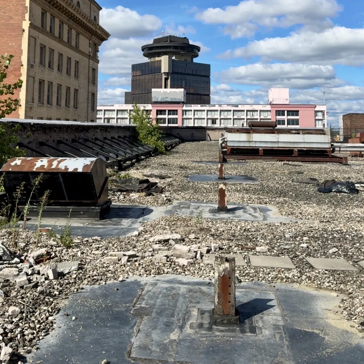 Ballasted flat roof with the downtown Rochester skyline beyond